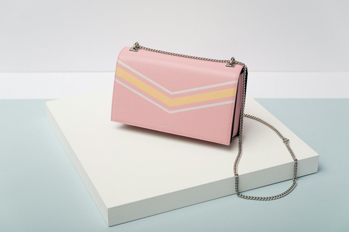Pink leather shoulder bag with a chain strap