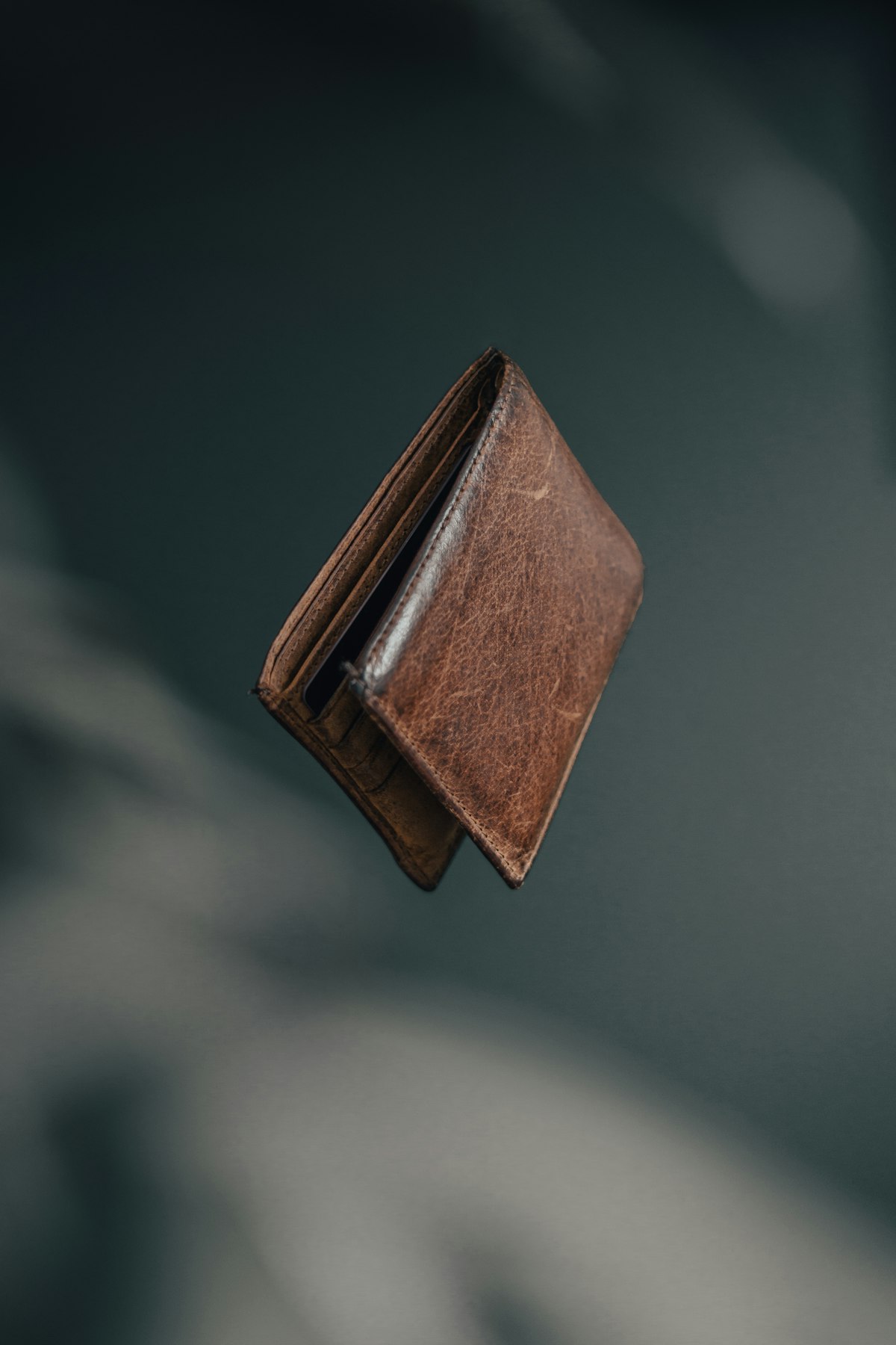 Worn brown leather bifold wallet