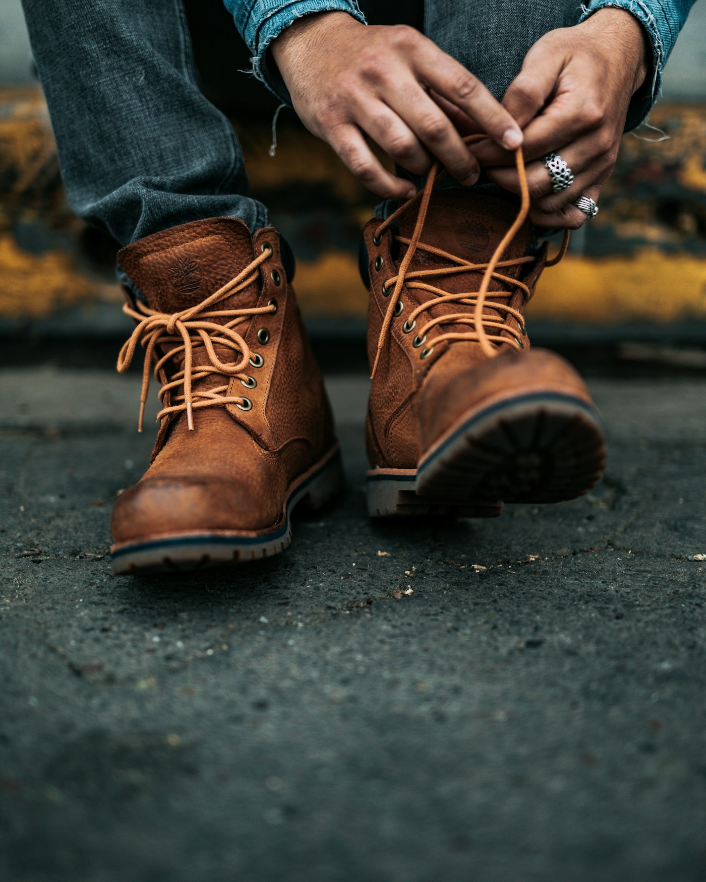Brown lace-up leather boots on a city street